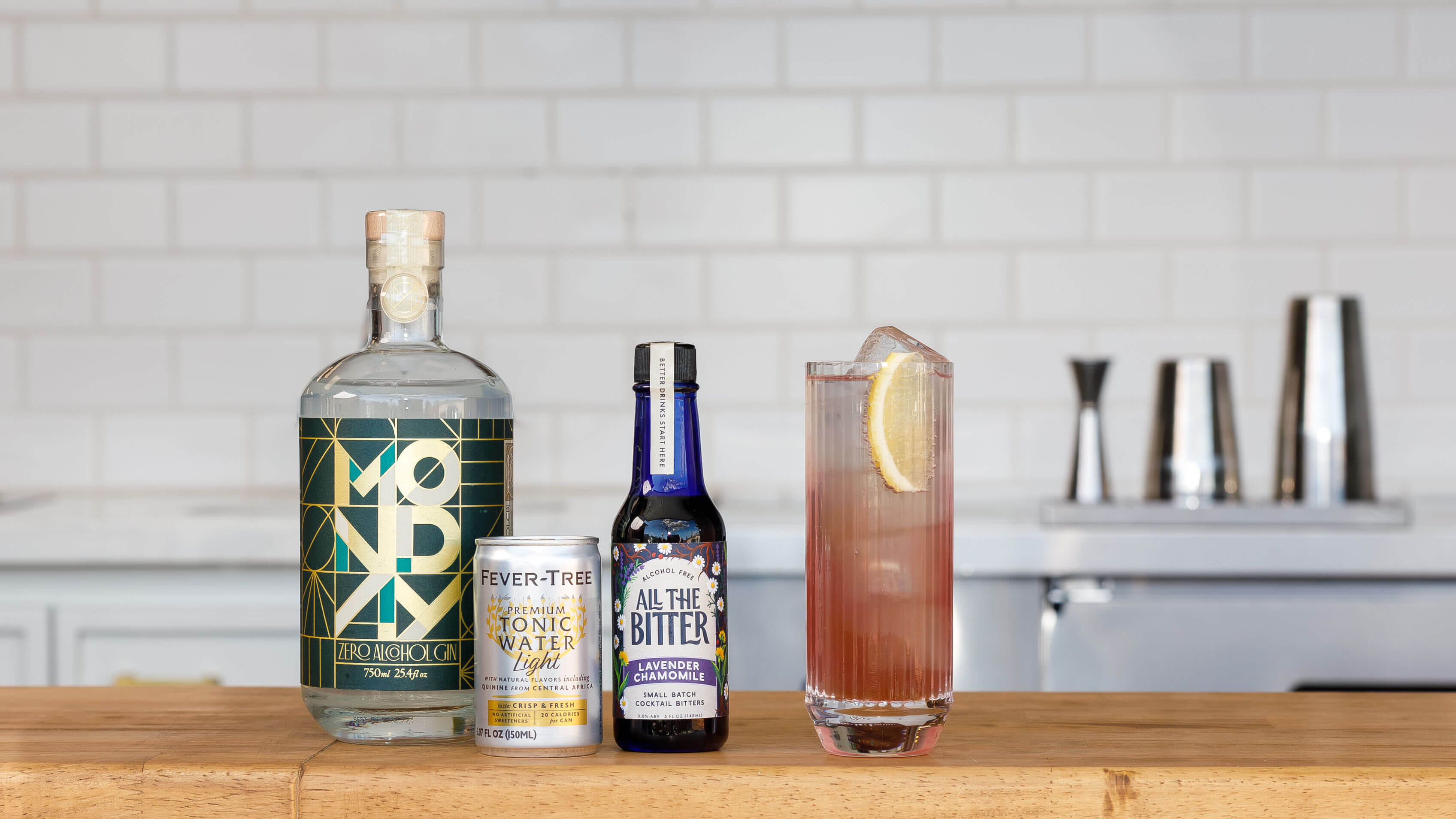 Lavender gin & tonic made with non-alcoholic Monday gin, light tonic, and lavender chamomile bitters.