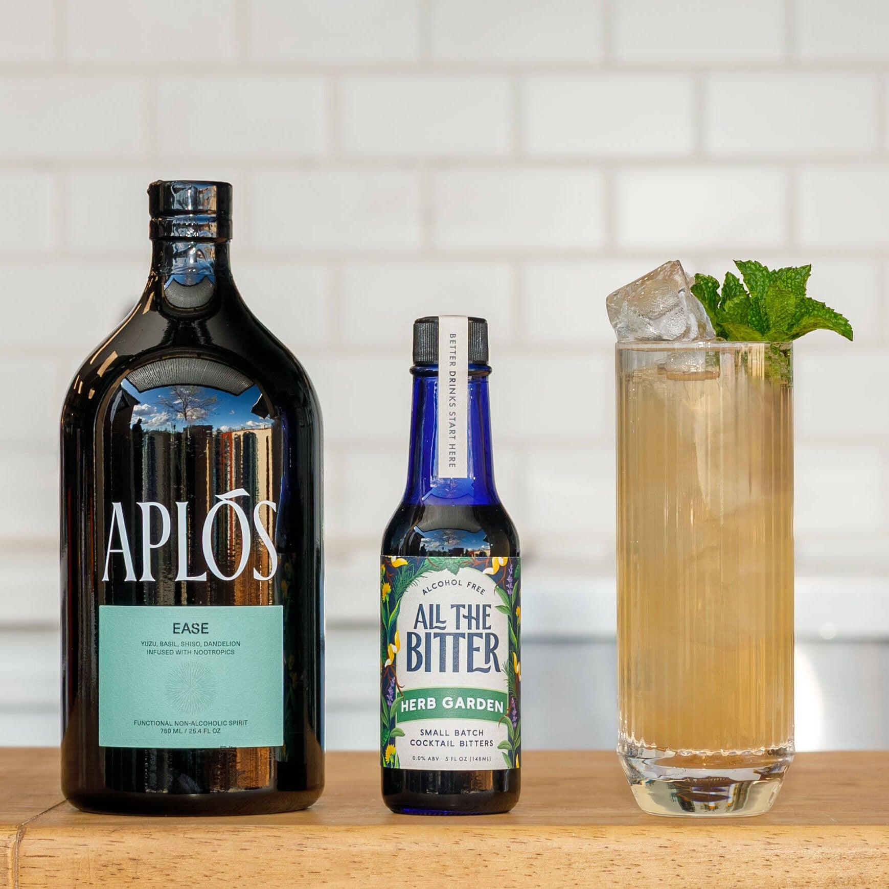 Nonalcoholic Garden Collins mocktail made with Aplos Ease and All The Bitter Herb Garden bitters, plus lemon and club soda.