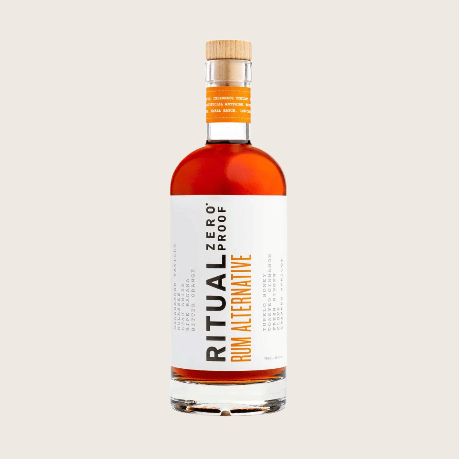 Bottle of Ritual Zero Proof Rum Alternative on a beige background style=