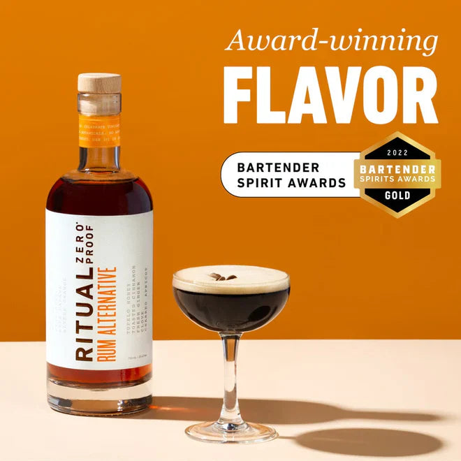 Bottle of Ritual Zero Proof Rum Alternative with a glass of dark liquid on an orange background, featuring award text.